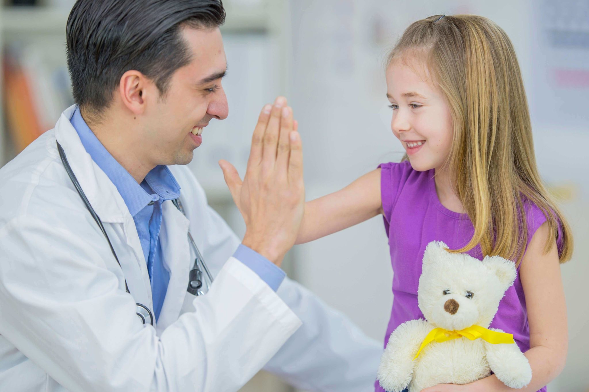 doctor high-fiving a child